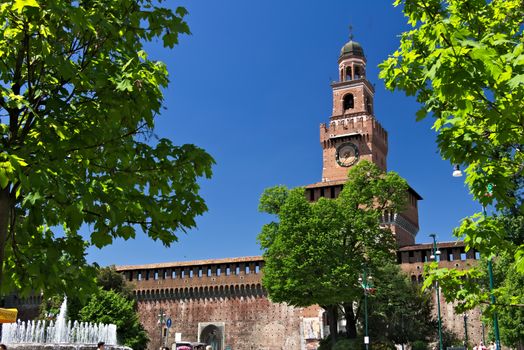 Milan, Lombardy, Italy, 04/27/2019. Sforza Castle. Tower with clock. The tower that overlooks the entrance to the walls of the castle of Milano. 