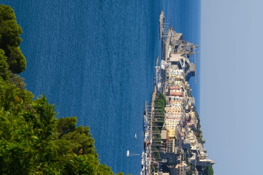 Panorama from the top of Portovenere, near the Cinque Terre, at sunrise light. The bay with the marina, the fort, the church of San Pietro. La Spezia