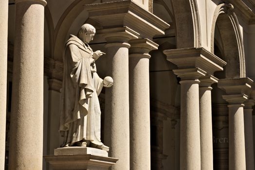 Milan, Lombardy, Italy, 04/27/2019. Brera Academy in Milan. A statue that adorns the courtyard. Around it is a portico with columns and in the center the statue of Napoleon.