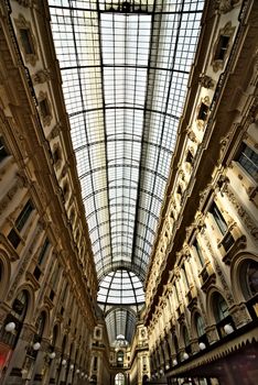 Milan, Lombardy, Italy, 04/27/2019. Galleria Vittorio Emanuele II of Milan. The gallery, built at the end of the 1800s, is an example of the first shopping centers. It contains high fashion stores.
