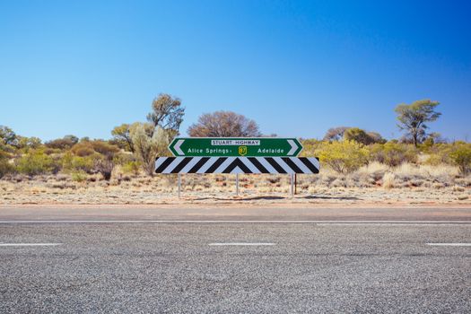 Erldunda, Australia - July 2: Road sign directing towards Uluru from the Stuart Hwy in the Northern Territory, Australia on July 2015