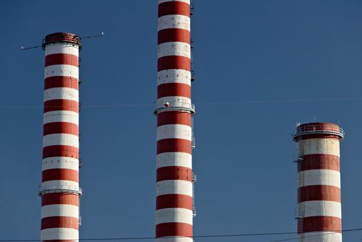 The white and red chimneys belong to the Iren plant in Turbigo, near Milan, Lombardy