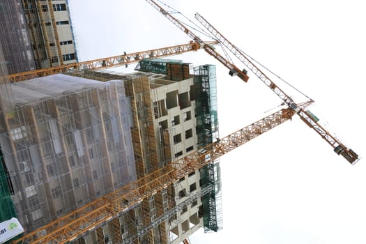 Amsterdam, Netherlands. About the July 2019. Construction site with cranes in Amsterdam. Construction of a new reinforced concrete building.