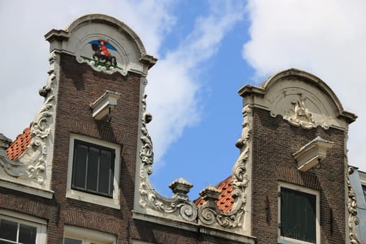 Amsterdam, Netherlands. Detail of facades of typical buildings with hooks for lifting goods in warehouses.