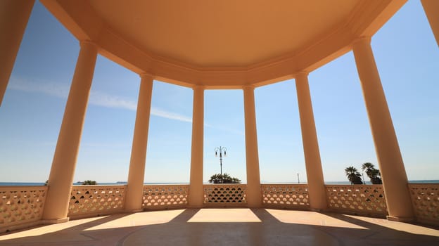 Circular gazebo temple of music near the Mascagni terrace. Interior view with columns framing the sea and the sky. Livorno, Tuscany, Italy. 