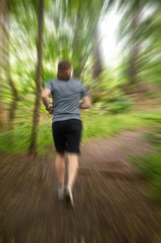 Man running in summer forest blurred motion speed consept