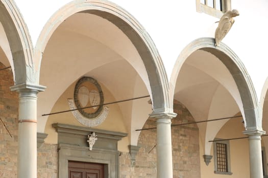 Portico of the Basilica of Santa Maria in Impruneta, near Florence. Arches and columns in pietra serena.