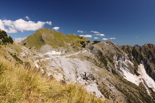 A landscape with Mount Sagro with clear sky and clouds. (Carrara, Toscana, Italy)