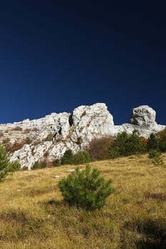 Details of mountains with a particular shape with a dark blue sky background.