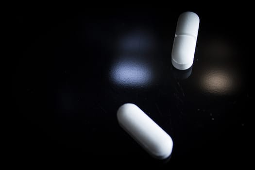 Woman holding generic white medicine pills