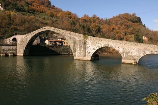 The bridge joins the two banks of the Serchio river and was built in medieval times.