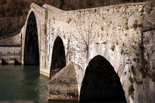 The bridge joins the two banks of the Serchio river and was built in medieval times.