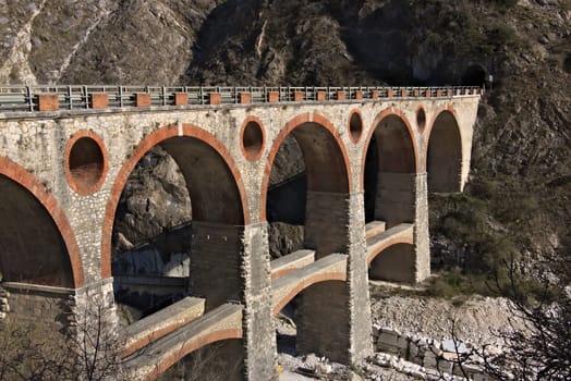 Ponti di Vara. Once used by the "Marble Railway", the bridge is now used by trucks that transport white marble blocks from the quarries to the depots.