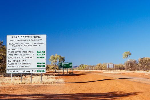 Gemtree, Australia - July 6 2015: Road restriction warning sign on Plenty Hwy near Alice Springs, Northern Territory, Australia