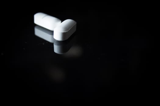 Woman holding generic white medicine pills