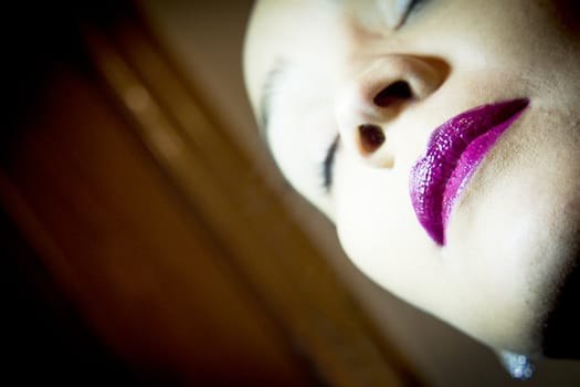 Lips made up of women in dark pink. Professional make up