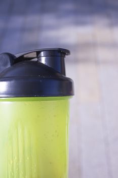 Transparent yellow shaker for sports drinks