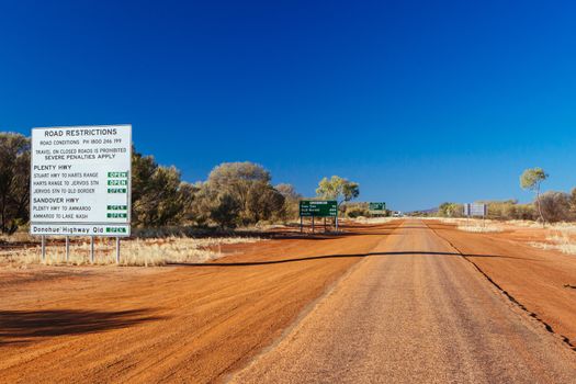 Gemtree, Australia - July 6 2015: Road restriction warning sign on Plenty Hwy near Alice Springs, Northern Territory, Australia
