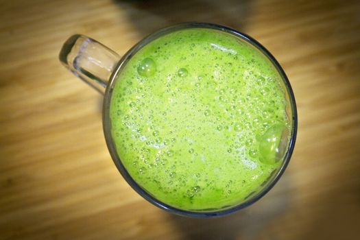 Green celery juice detoxifying drink. Vegan drink