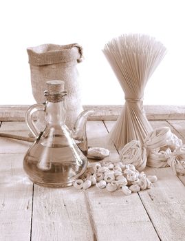 Pasta in a wooden table of kitchen.