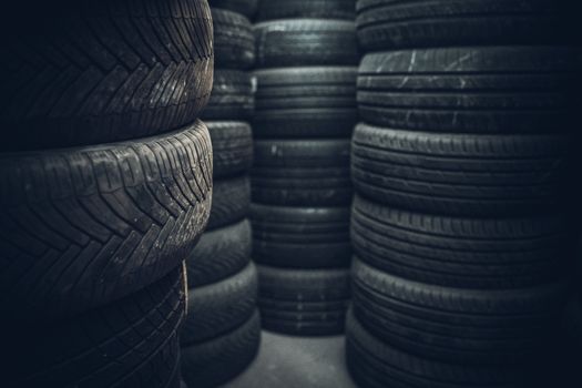 Tire sets in a car repair shop ready for a seasonal change on cars