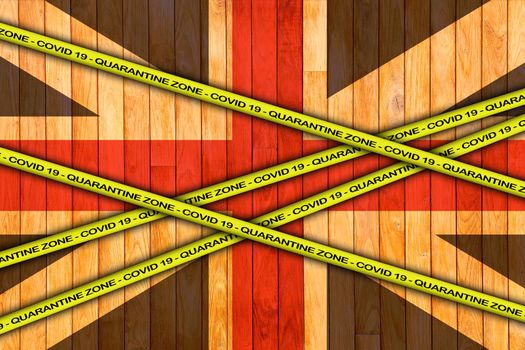 COVID-19 warning yellow ribbon written with: Quarantine zone Cover 19 on United Kingdom flag illustration. Coronavirus danger area, quarantined country.