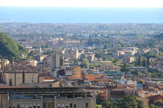 Panoramic view of the city of Carrara, at the foot of the Apuan Alps. In the background the sea.