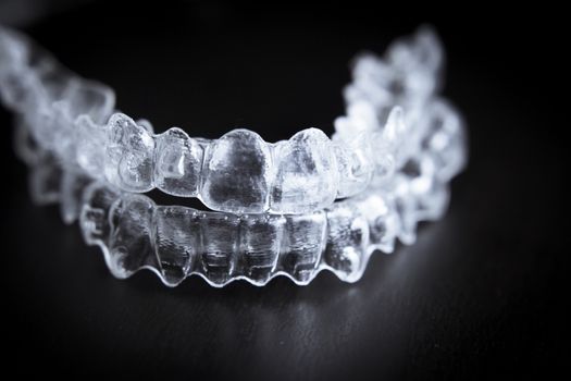 Transparent plastic dental retainer teeth alignment corrector. No people