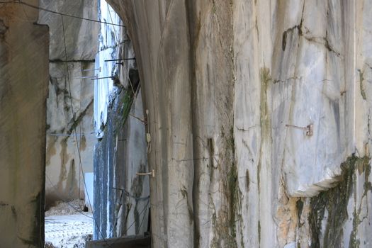 White Carrara marble quarry made in the gallery. The use of diamond tools allows to dig the marble blocks in underground galleries.