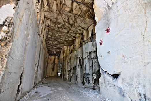 White Carrara marble quarry made in the gallery. The use of diamond tools allows to dig the marble blocks in underground galleries.