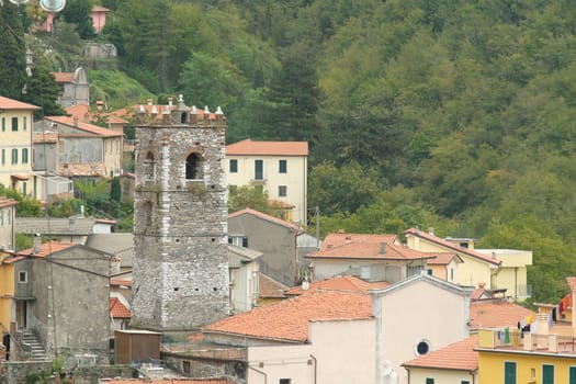 Colonnata, Carrara, Italy. About october 2019.  Overview of the village of Colonnata, where the famous lard is produced. The walls of the houses in stone and white Carrara marble. Woods background. Northern Tuscany.