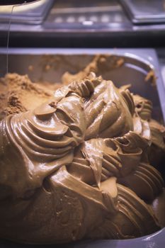 Artisan ice cream in a metal container to keep the cold. No people