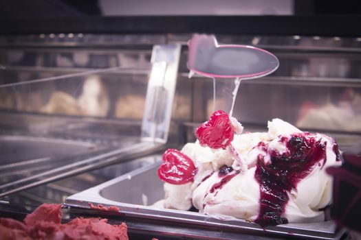 Artisan ice cream in a metal container to keep the cold. No people