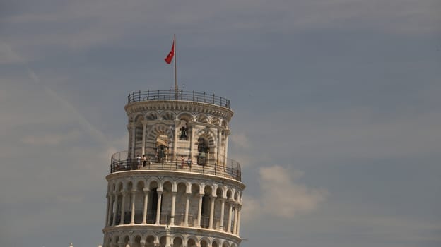 Pisa, Tuscany, Italy. 06/21/2019. Leaning tower of Pisa. Cell with bells. The tower is built entirely with white Carrara marble. On the top floor, visiting tourists.