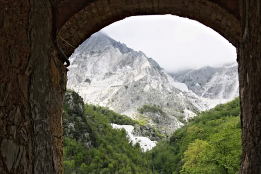 Colonnata, Carrara, Tuscany, Italy. Mountains with the Carrara White Marble quarries seen from Colonnata. The ancient town of marble quarrymen is famous for the production of lard.