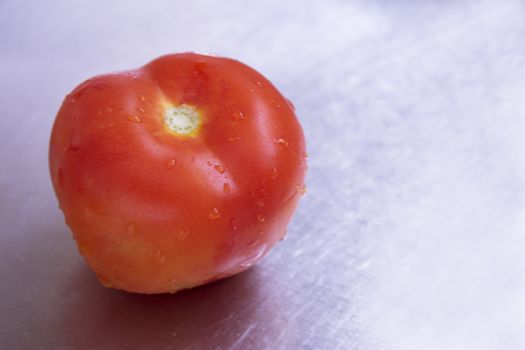 Freshly washed salad tomato. No people