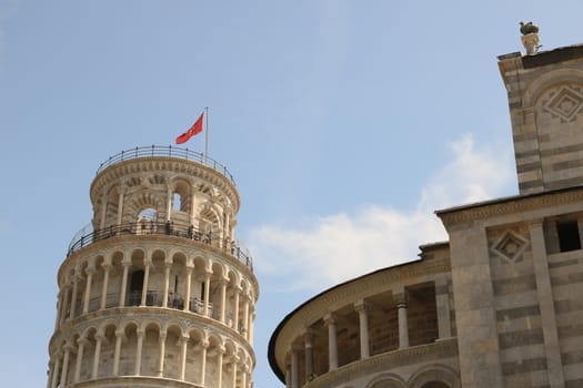 Pisa, Tuscany, Italy. 06/21/2019. Leaning tower of Pisa. Cell with bells. The tower is built entirely with white Carrara marble. On the top floor, visiting tourists.