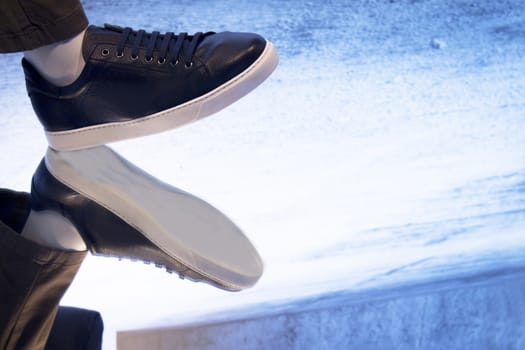 Mannequin foot of man in walking position reflected on the ground