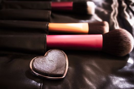 Facial makeup, eyeshadow and makeup brushes. No people