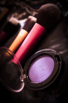 Facial makeup, eyeshadow and makeup brushes. No people