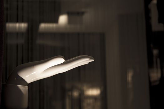 White mannequin hand. Palm down. No people