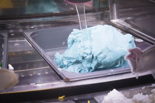 Artisan ice cream in a metal container to keep the cold. No people