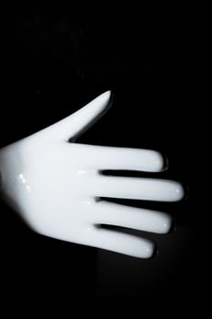 White mannequin hand. Palm down. No people