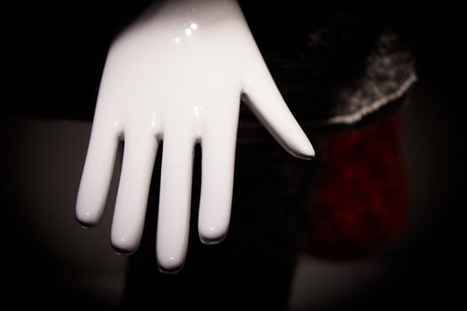 White mannequin hand. Palm down. No people