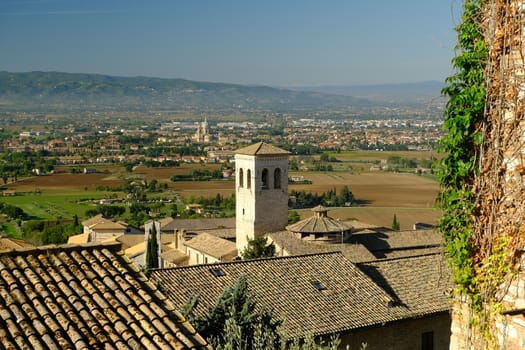 Panorama of the Assisi countryside with churches, houses and trees. From the top of the city you can enjoy a splendid panoramic view of the valley.