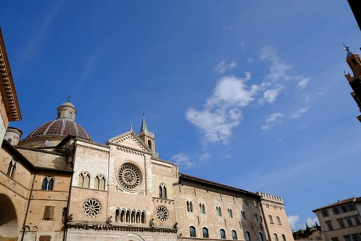 Foligno, Umbria, Italy. About october 2019. Cathedral of San Feliciano in Foligno with historic buildings. The Romanesque church with stone facades in Piazza della Repubblica.