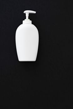 Blank label cosmetic container bottle as product mockup on black background, hygiene and healthcare