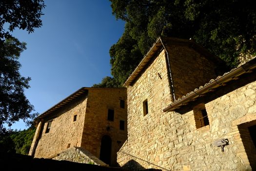 Assisi, Umbria, Italy. About october 2019. Hermitage of the Carceri of Assisi where St. Francis retired to pray. Made of light stone it is placed inside a forest.