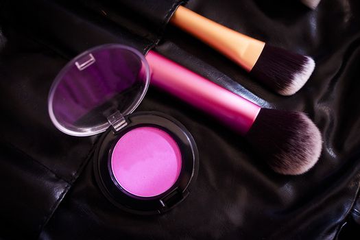 Facial makeup, eyeshadow and makeup brushes. No people