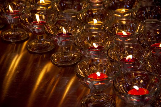Candle lights in glass at Chinese temple